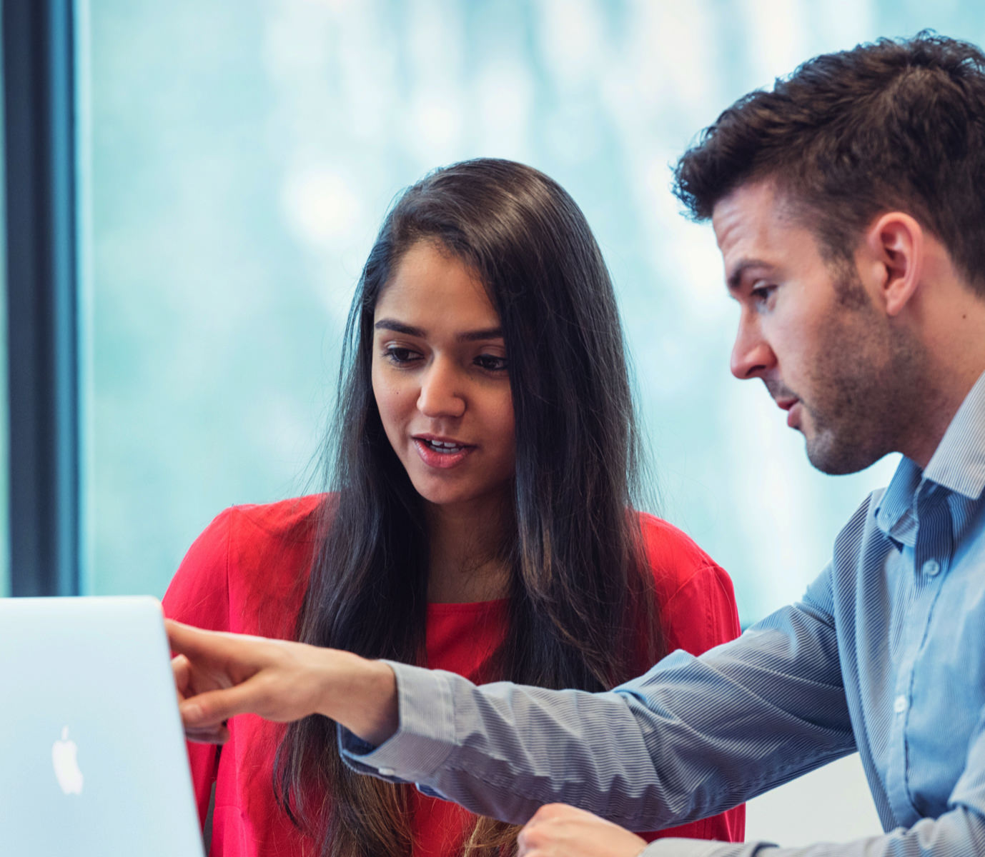 Two team members working together